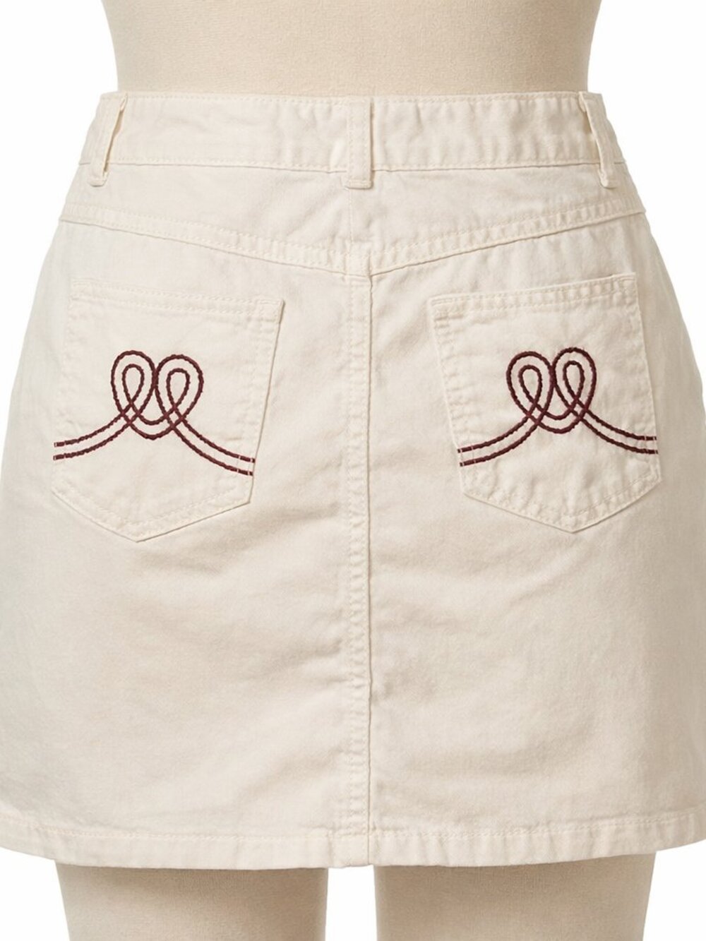 Vintage y2k Love Moschino white mini skirt size small with red heart stitching.